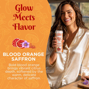A smiling woman in a cream satin shirt holds a can of Glow Up Sparkling Collagen Protein – Blood Orange Saffron, a beauty beverage. Text reads, “Glow Meets Flavor: Blood Orange Saffron” with images of blood oranges and saffron flowers.