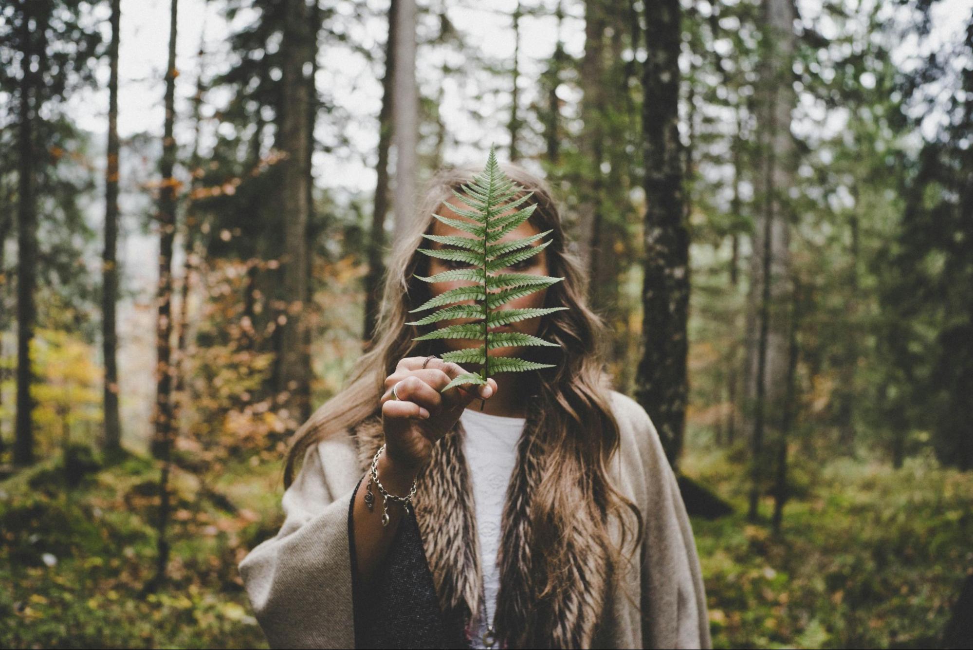 Woman Holding Fern