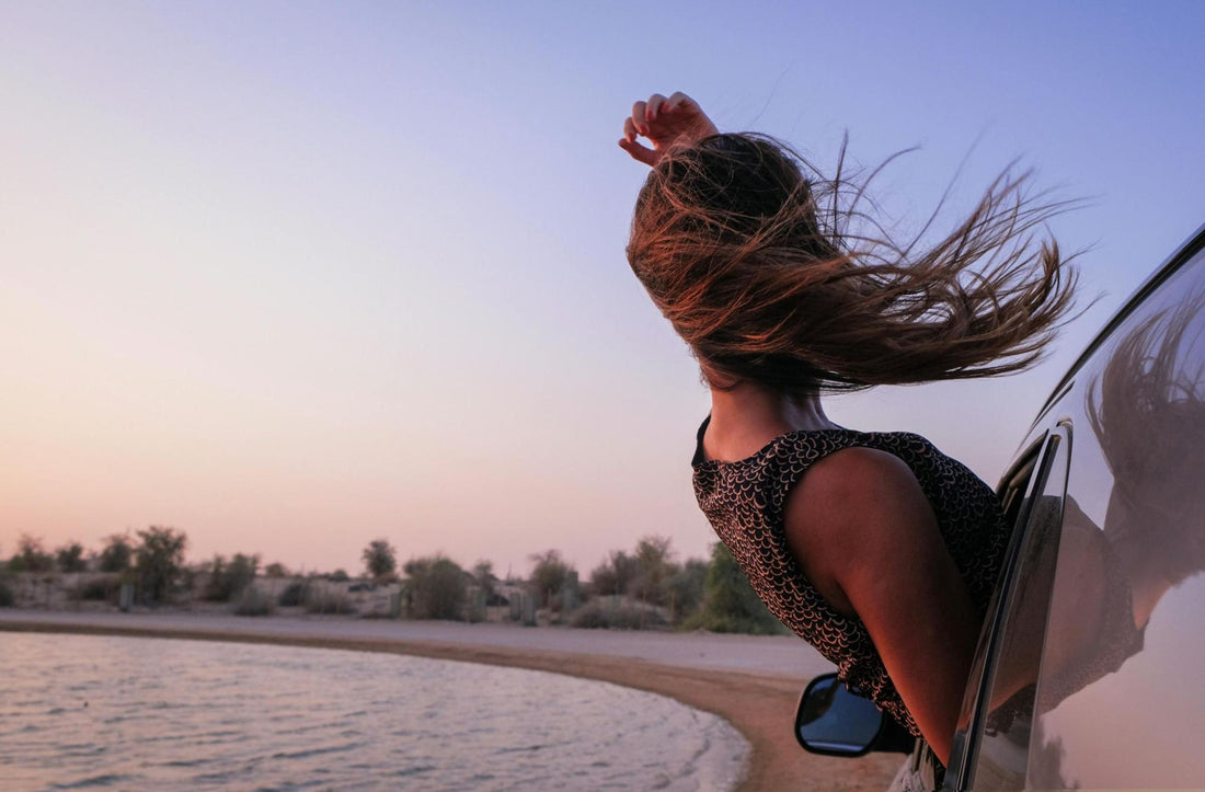 Woman’s Hair Blowing Out Window