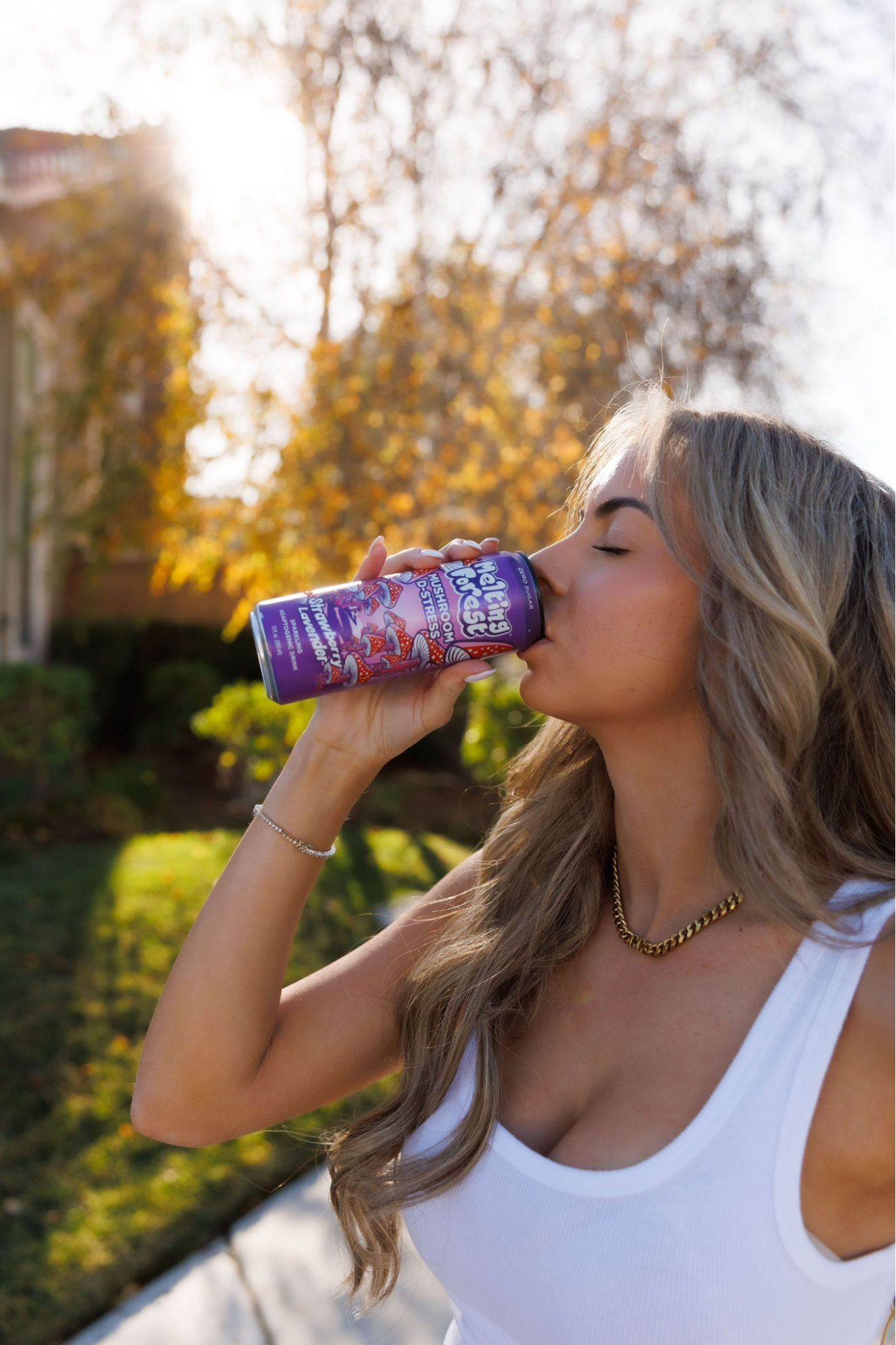 A woman drinking a mushroom drink.