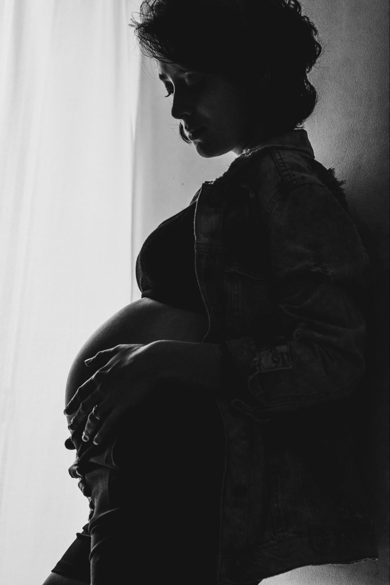 Woman Holding Belly Black and White