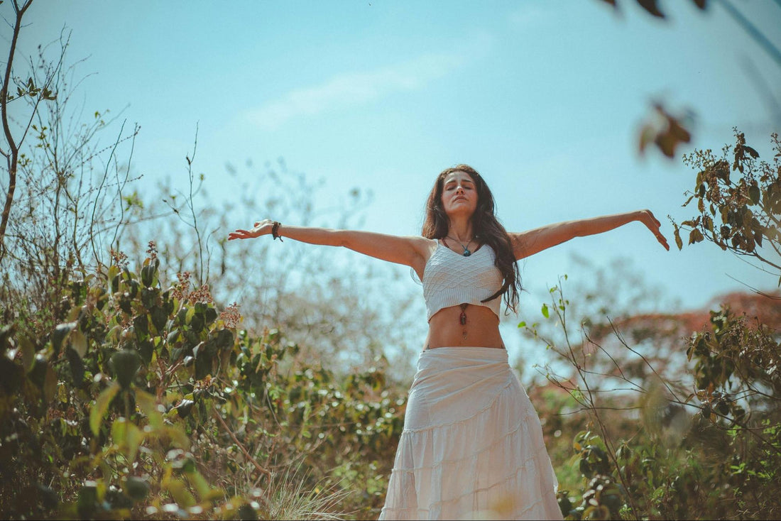 Woman with Arms Stretched in Nature