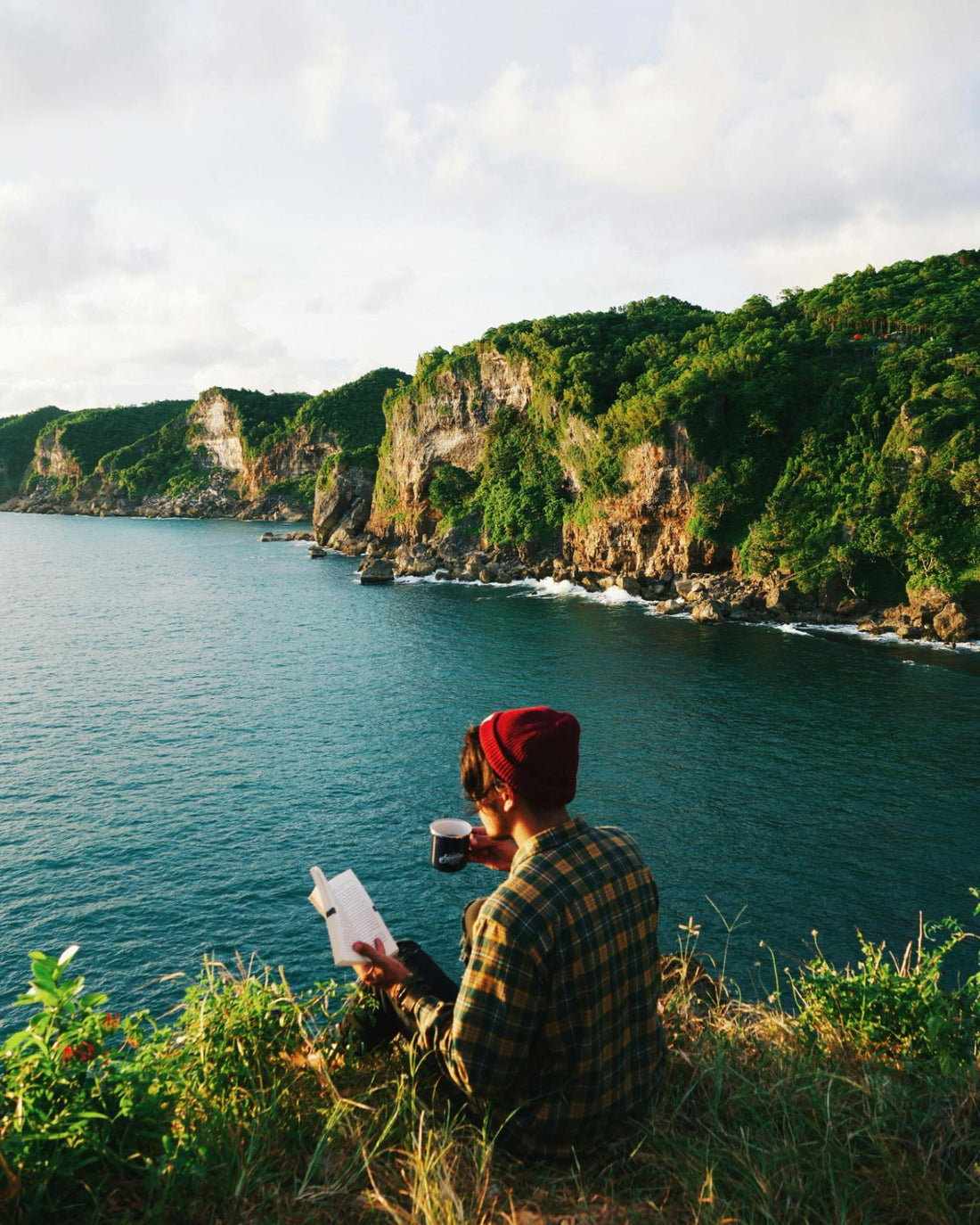 Man Drinking Coffee with Ocean View