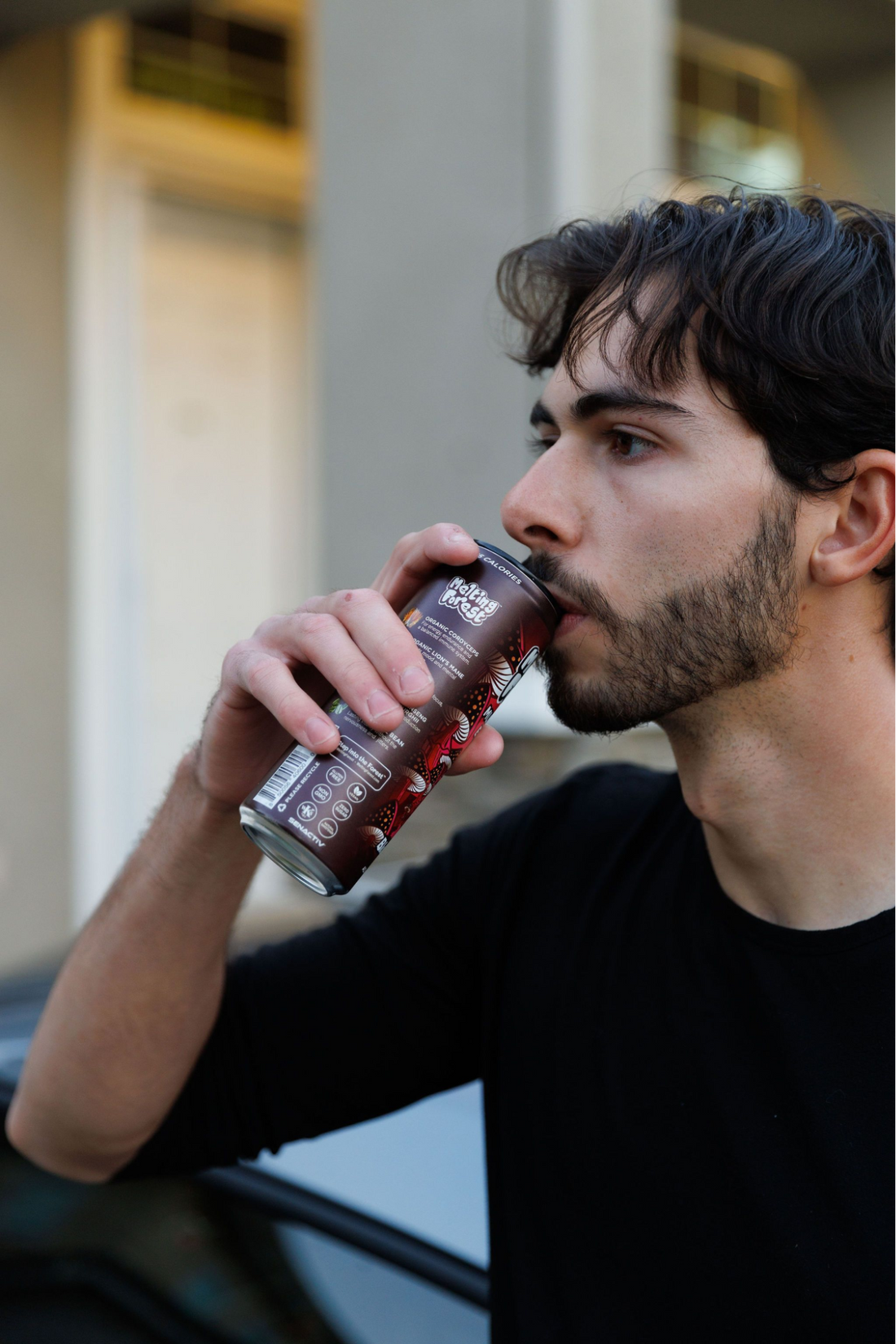 A man drinking a mushroom drink.