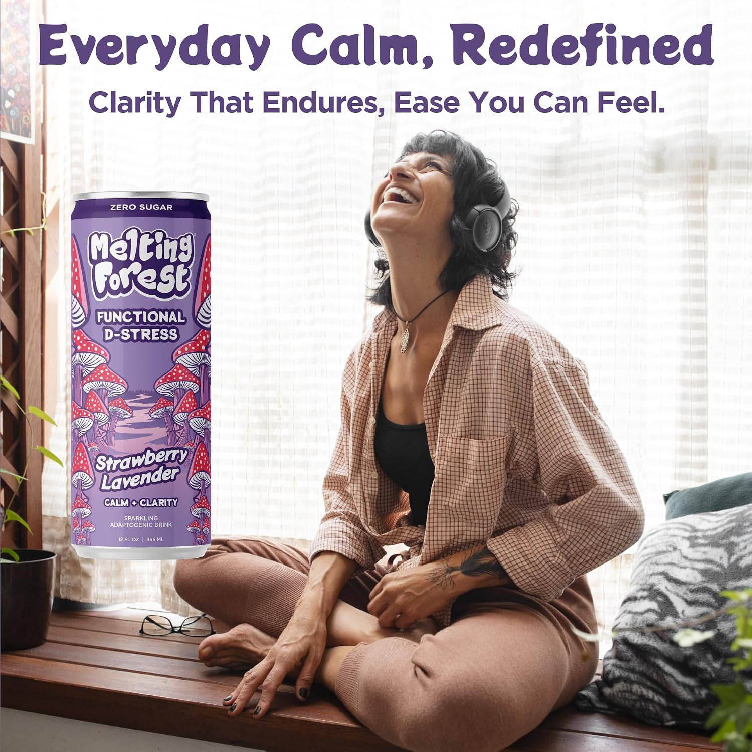 A smiling woman with headphones relaxes by a window, next to a Mushroom D-Stress Drink 12 Pack - Strawberry Lavender. Above her: "Everyday Calm, Redefined. Clarity That Endures, Ease You Can Feel.